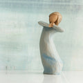 Willow Tree Journey, 5.5”h hand-painted standing resin figure in blue dress, arms raised up to face as if dancing, in front of blue/grey painting