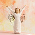 Willow Tree Courage, 6”h hand-painted standing resin angel figure in cream dress with wire wings, both arms upraised, in front of orange painting