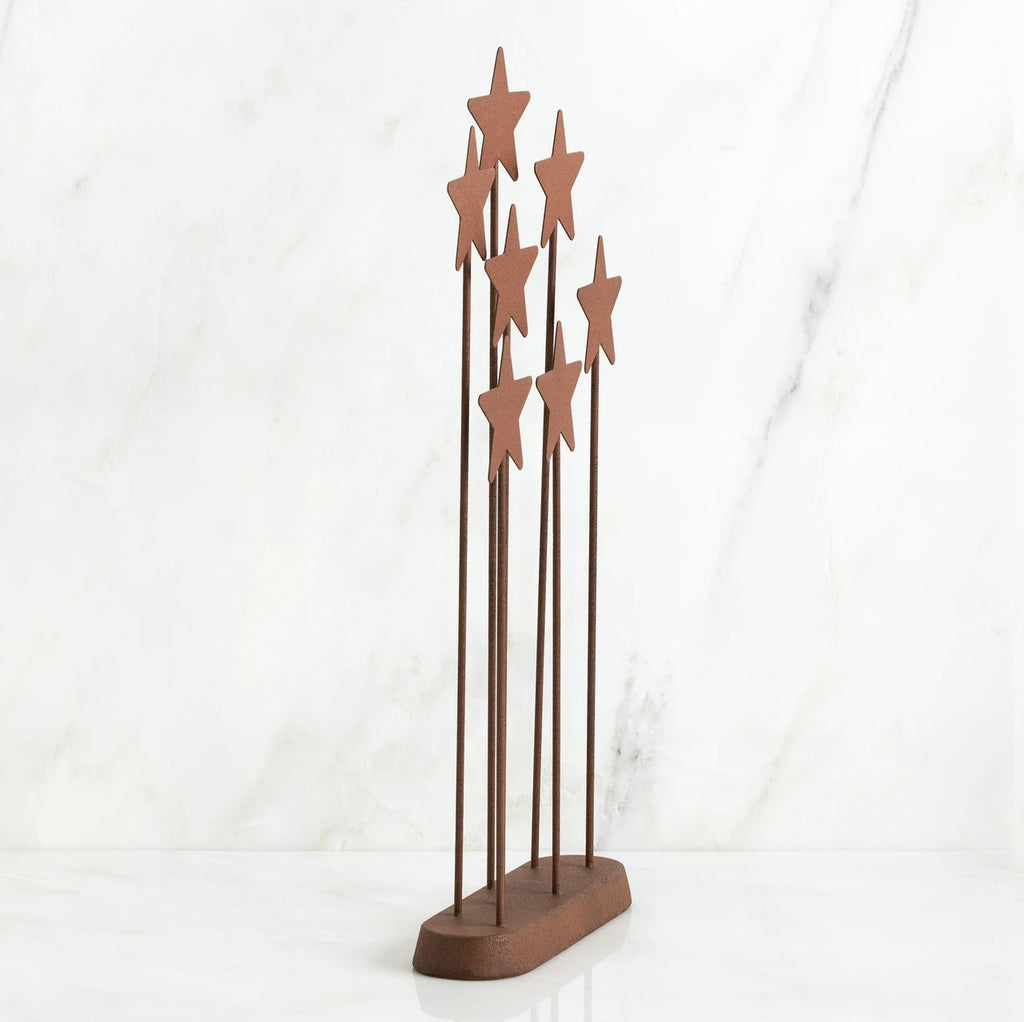 Bronze plaque with star stands on top of it