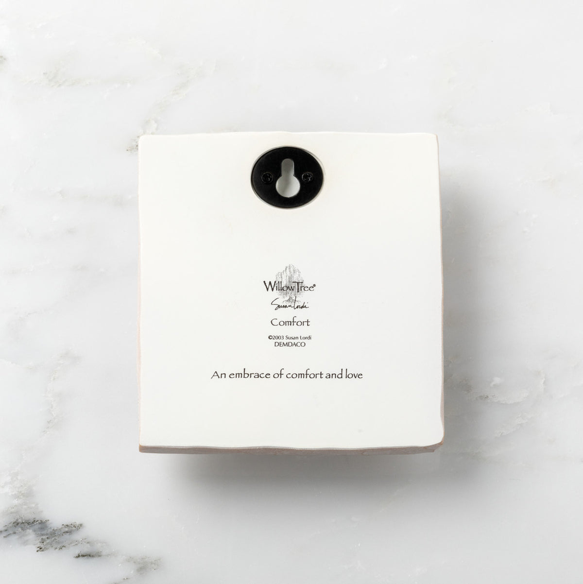 Back of white plaque reading piece title and sentiment, with Willow Tree logo