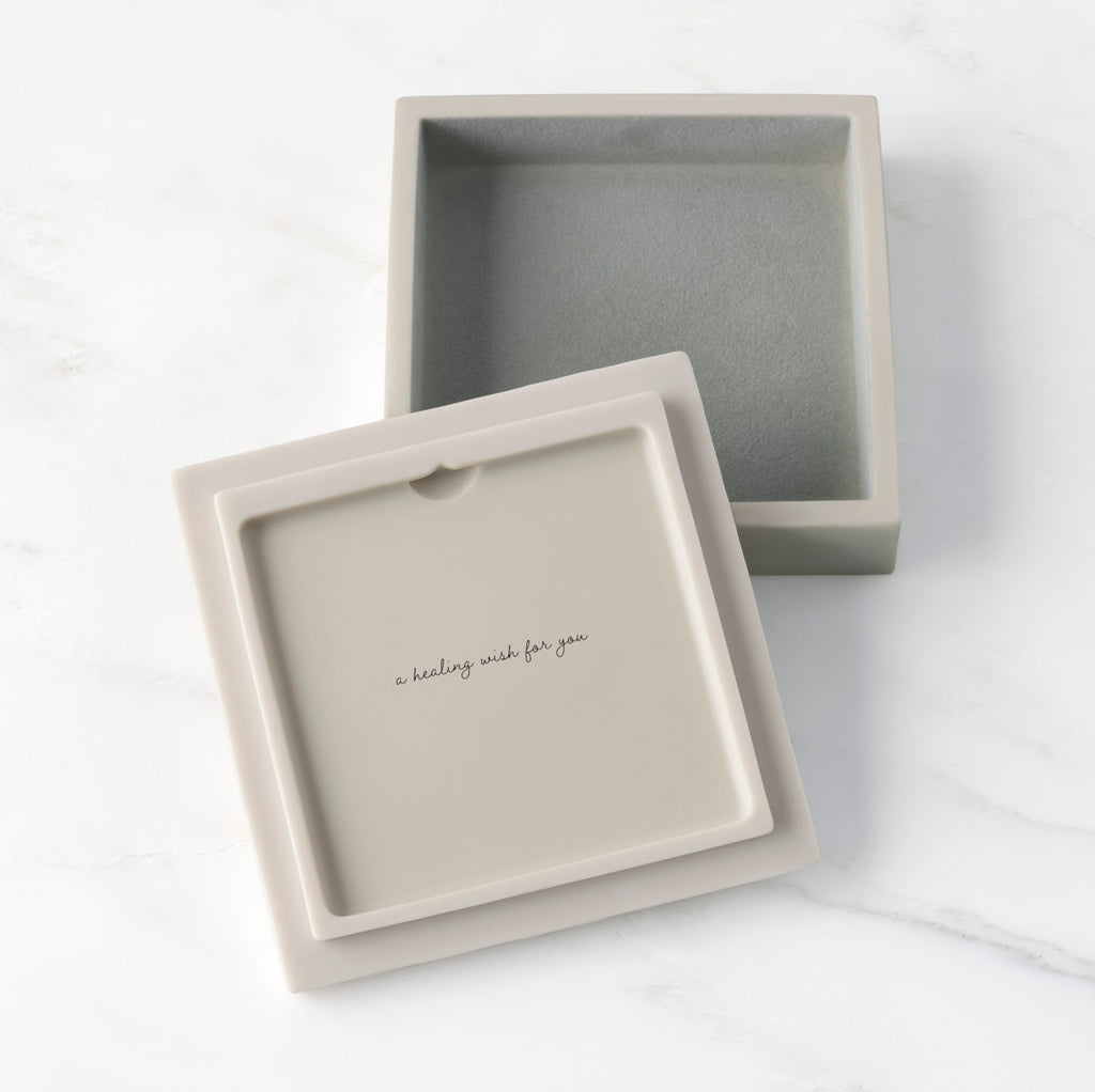 White resin box with detached lid showing sentiment on lid back; velvety gray-green finish in box base