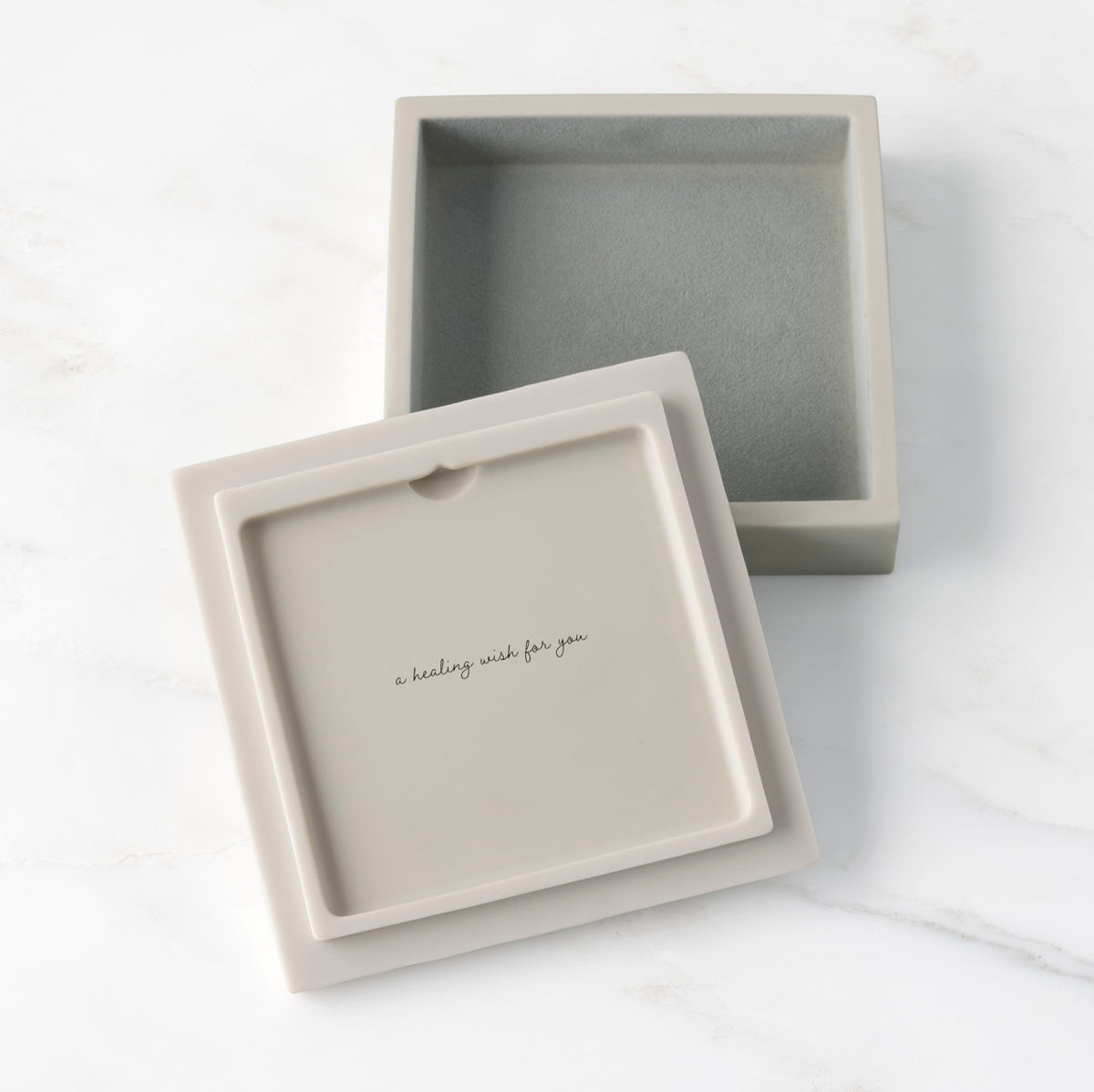 White resin box with detached lid showing sentiment on lid back; velvety gray-green finish in box base
