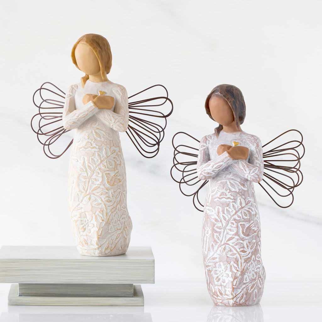 Lighter &amp; Darker skin versions of angel with wire wings, arms crossed over gold heart, carved with symbols of remembrance