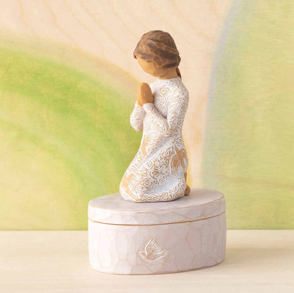 Willow Tree Prayer of Peace Keepsake Box, 3.5"oval hand-painted resin box with 3”H kneeling figure in cream dress carved with nature imagery, in prayer/meditation pose, affixed to lid, in front of green painting
